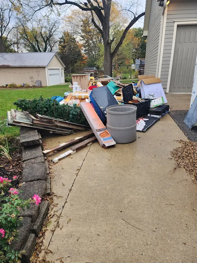 Dumpster being loaded with debris for Residential Dumpster Rental in Lyndhurst